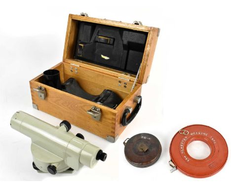 An oak cased Mom of Budapest Ni-B4 surveying camera, numbered 258027, with folding stand, together with two surveyors' measur
