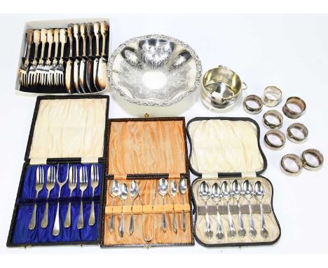 A small quantity of assorted silver plate to include cased sets of forks, various napkin rings, also a hallmarked silver napk