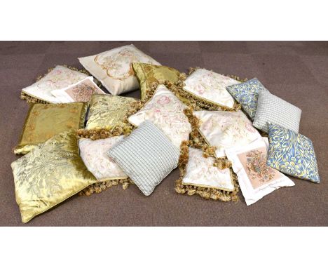 Seventeen modern cushions including floral examples, examples with tassels and gold coloured examples, the largest approx 55 