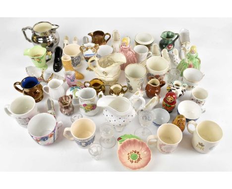 A quantity of decorative and sundry ceramic items to include Carltonware, ceramic shoes, various decorative mugs, etc.