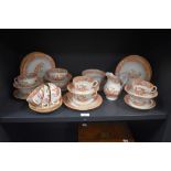 A selection of Victorian hand painted teaware, the design featuring Chinese landscapes with pagodas,