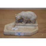 An Art Deco alabaster pen stand, the surmount modelled as a bear and measuring 15cm long