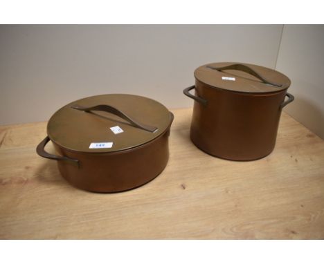 Two mid-20th Century copper lidded pots by Jens Quistgaard for Dansk Design, the smaller pot having a ceramic liner with make