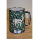 A 20th Century Jerusalem pottery tankard of Faience style, decorated in polychrome with a gazelle