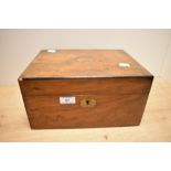 A 19th Century walnut writing slope, the ebony strung case opening out to a tooled leather and