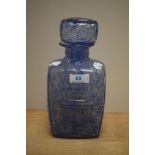 A Scandinavian moulded art glass decanter with stopper, possibly by Bjorkshults and of Cubist