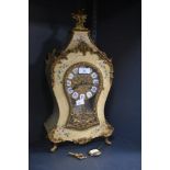 A reproduction French style mantel clock by Franz Hermle, the shaped case decorated with a printed