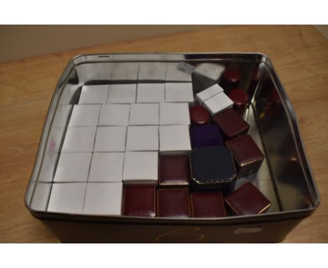 An assortment of empty ring boxes of various design