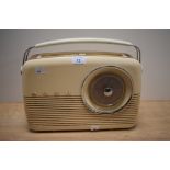 A Bush cream coloured bakelite radio, Receiver Type TR 82 DL, measuring 33cm long