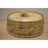 A 19th Century Wedgwood buff stoneware pie dish and cover, decorated in relief with fruiting