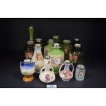 A hand painted porcelain bud vase, decorated with a scene illustrating cattle watering, having a