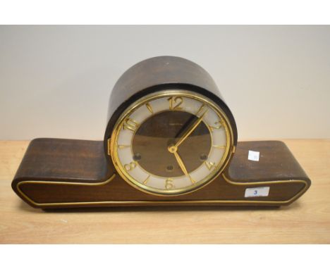 A 20th Century Mauthe German mantel clock of Art Deco design, the face with a silvered chapter ring and brass Arabic numerals