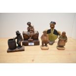 An early 20th Century novelty bottle opener and holder, modelled as a rotund man wearing a fez and