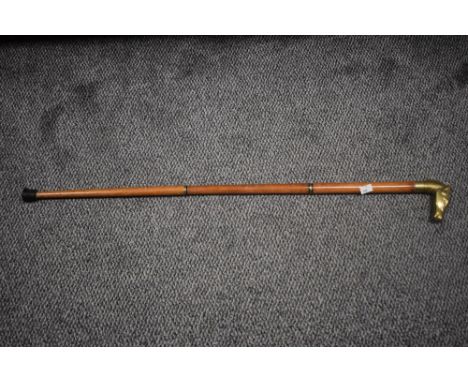 A 20th Century adjustable walking stick with brass horse head handle, measuring 90cm long