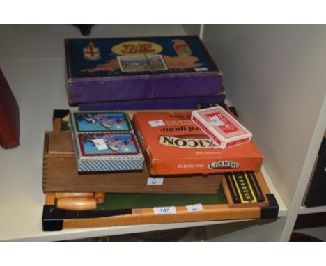 A Kay of London table top skittles game, a box of dominoes, two Chad Valley jigsaw puzzles, and card games