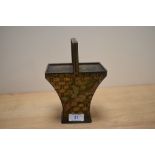 An early 20th Century Huntley & Palmers biscuit tin in the form of a fruit basket, with lithographed