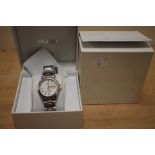 A boxed Seiko wristwatch, the white dial having gold baton numerals and date aperture, on a two-tone