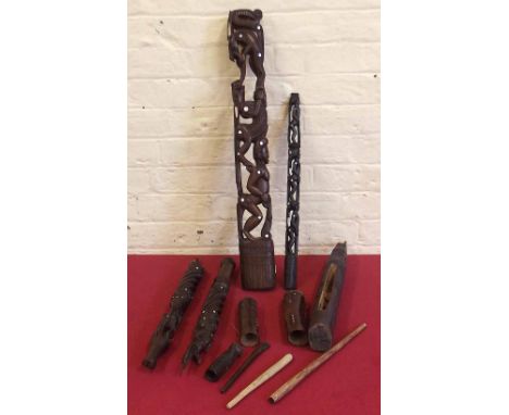 Two Melanesian figural posts finely carved and inlaid with pearl, a similar staff (broken at the centre) also three small dru
