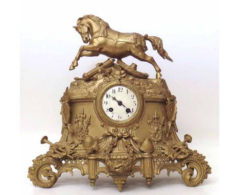Gilt metal mantle clock with War Horse pediment. Condition report: see terms and conditions.