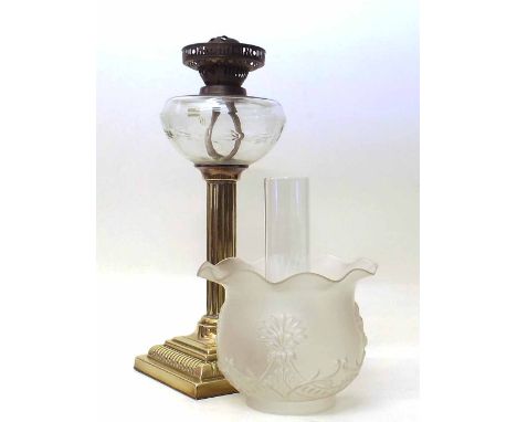 Brass table oil lamp with a cut glass reservoir and frosted shade, height to burner 43cm. Condition report: see terms and con