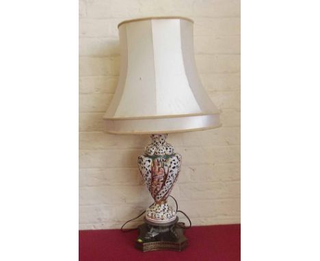 Capo di Monte table lamp on pierced brass base complete with shade. Condition report: see terms and conditions.