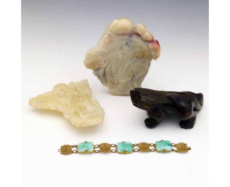 Chinese carved soapstone flat back figure of  Shou Lao, height 13.5cm; a carved soapstone bracket of a monkey figure, height 