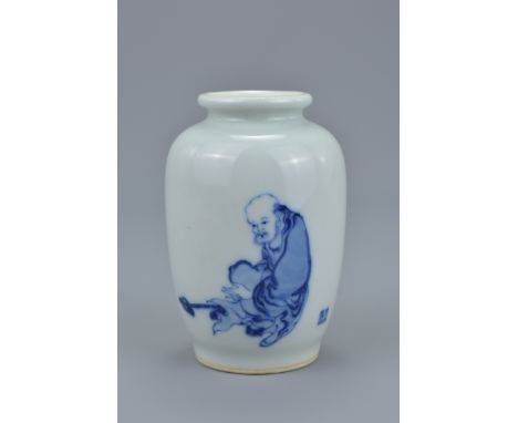 A small quality Chinese Republic period blue and white porcelain vase painted with single figure of Immortal next to a small 