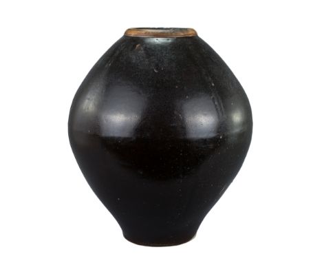 A Large Chinese Glazed Stoneware Storage Jar - 19th Century. With four wide vertical light impressions to the upper body, and
