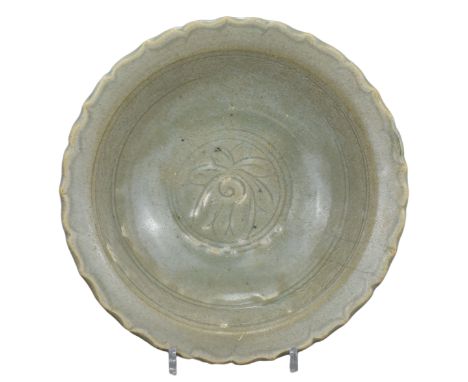 A Large Chinese / SE Asian 14th - 15th Century Celadon Dish. Heavily-potted with a foliate rim. The inner surface is decorate