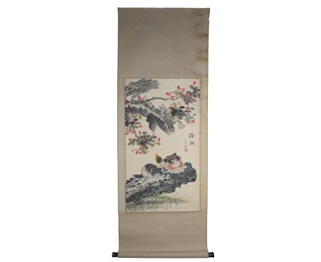 A Chinese watercolour painting on paper in scroll with wooden handles of two cats lying under a tree with one red seal mark d