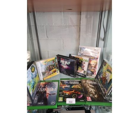 Shelf of xbox one games, playstation 1 games etc. 