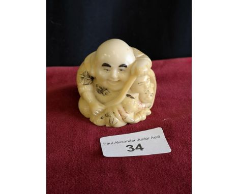 Oriental monk Netsuke signed to base. 