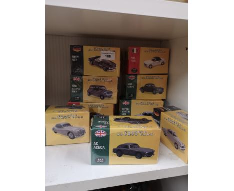 Shelf of vintage classic sport car models boxed. 