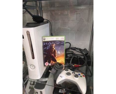 Shelf of xbox console with power supply and 360 game. 