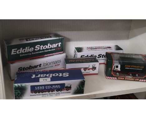 Shelf of boxed Eddie Stobart models etc. 