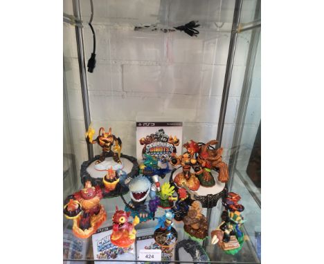 Shelf of PlayStation 3 skylanders with game and ports. 