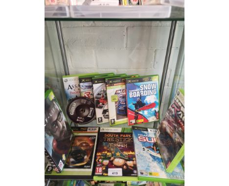 Shelf of xbox original and xbox 360 games. 