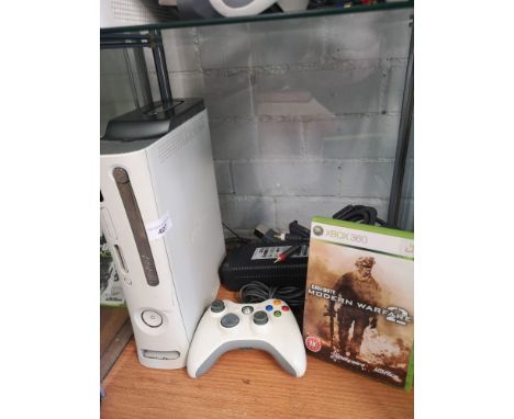 Xbox 360 console with power supply, controller and game. 