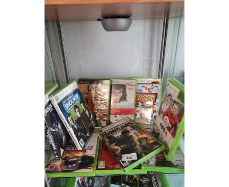 Shelf of xbox 360 games. 