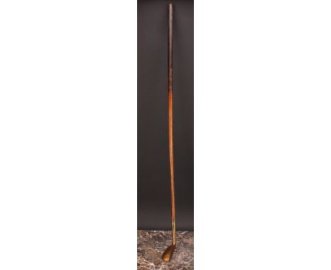 Golf Club - an early 20th century putter, lacquered brass finish, inlaid iron sole, hickory shaft, stamped K E Y, 91cm long 