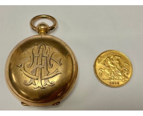 A George V gold half sovereign, 1912, in a rose gold plated Dennison half sovereign case, monogrammed, 5cm over suspension lo