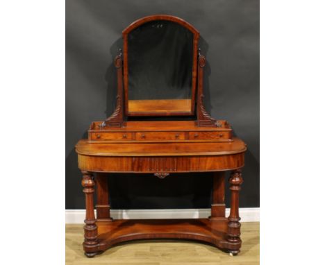 A Victorian mahogany duchess dressing table, arched rectangular mirror above three small drawers, the projecting base with a 