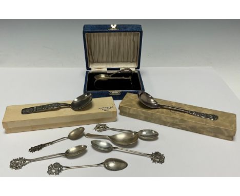 A Norwegian silver souvenir spoon, Bergen, marked 60GR, 31g, boxed; another similar spoon, marked 830, 21g, boxed; a set of f