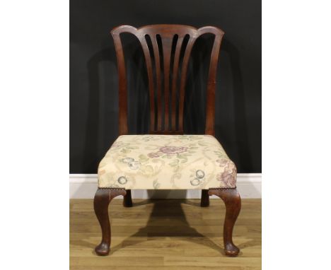 A George II mahogany provincial Chippendale chair, of low proportions, stuffed-over seat, cabriole forelegs, pad forefeet, 83