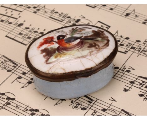 A George III South Staffordshire enamel oval patch box, hinged cover painted with a bird, pale blue base, 4cm wide, c.1800 
