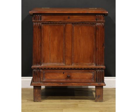 An 18th century Continental cherry vestment chest, hinged top enclosing a pair of compartments, drawer to base, the two panel