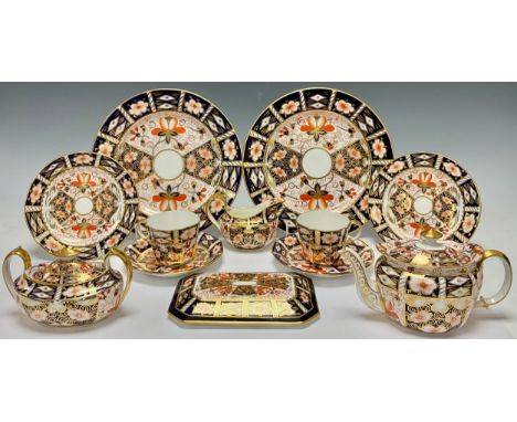 A Royal Crown Derby Imari 2451 pattern teapot, year cypher for 1931, sucrier and cover, milk jug, pair of cups, saucers and t