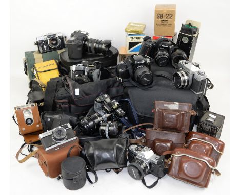 Large collection of cameras and lenses to include a Canon AV-1 with Canon 50mm 1.8 lens, a Zoom Nikor 70-210mm f/4-f/56 lens,