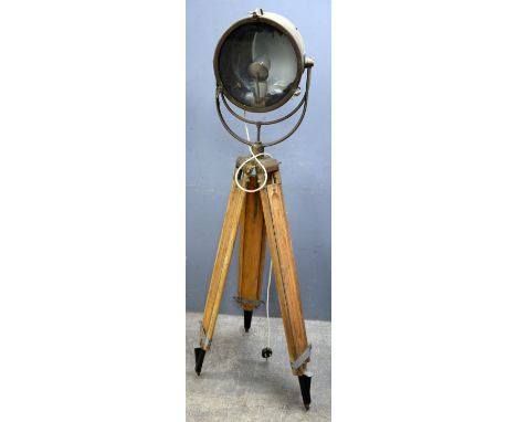 Early 20th century brass spot light on original adjustable tripod base 