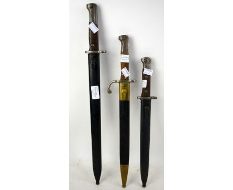 Late 19th early 20th century German dagger/ bayonet by Simpson &amp; Co., Suhl in leather and brass sheath, 45cm and two othe